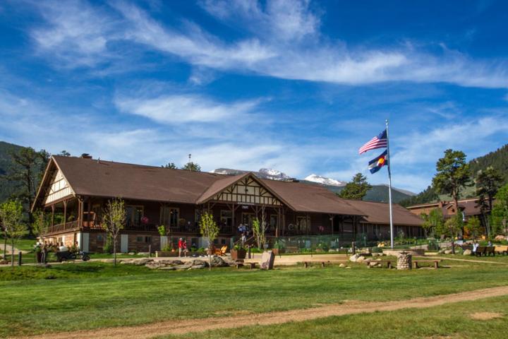 a building with an american flag in front of it at YMCA of the Rockies in Estes Park
