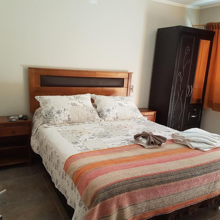 Postel nebo postele na pokoji v ubytování Vicuña Lodge