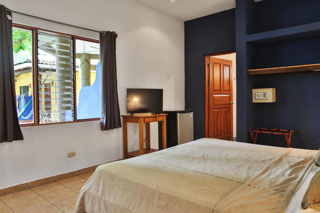 Postel nebo postele na pokoji v ubytování Villas Macondo