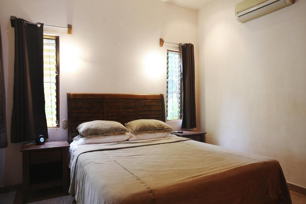 Postel nebo postele na pokoji v ubytování Villas Macondo