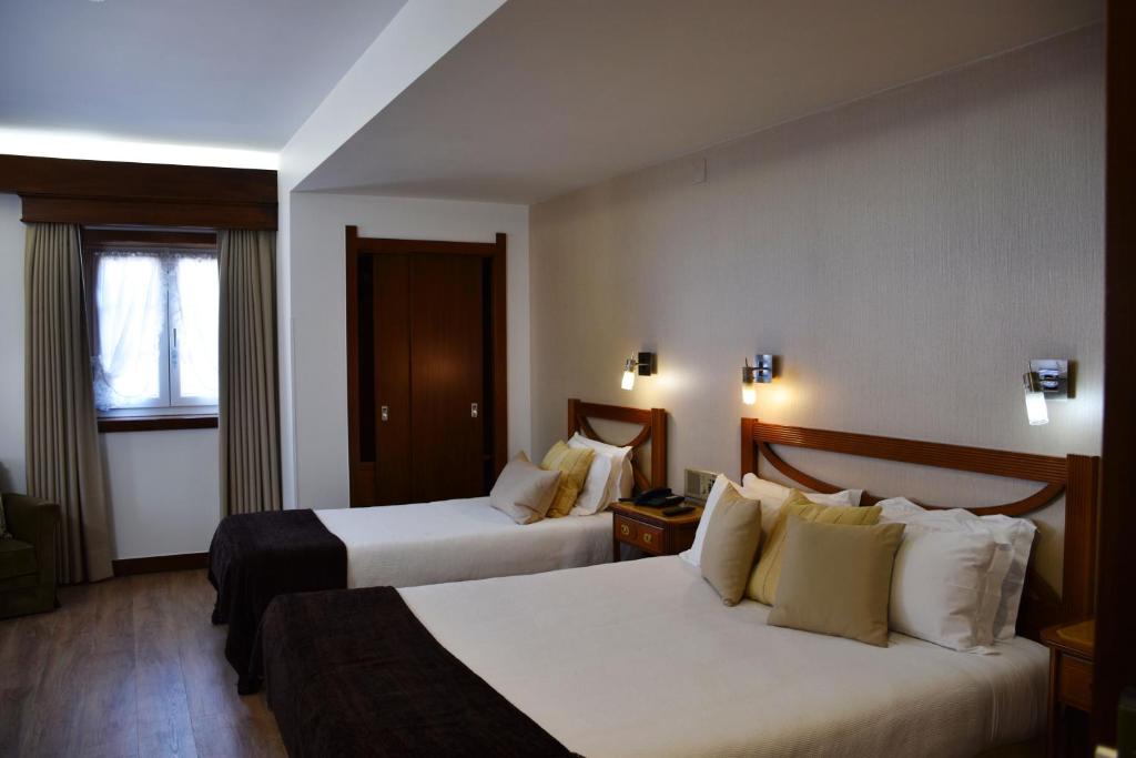 Postel nebo postele na pokoji v ubytování Hotel Dona Sofia