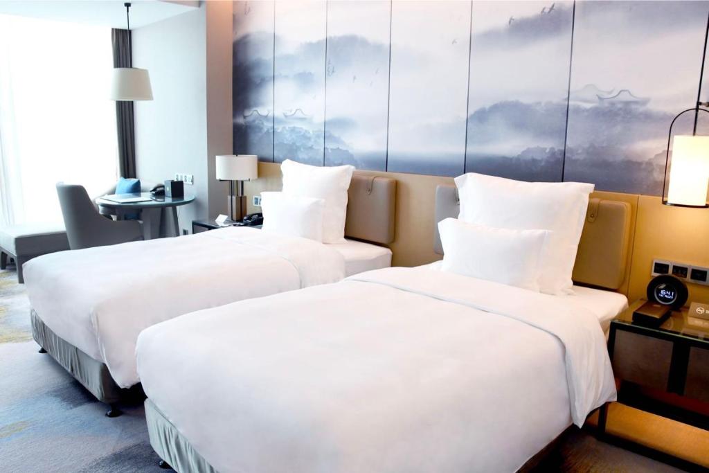 Postel nebo postele na pokoji v ubytování Pullman Fuzhou Tahoe