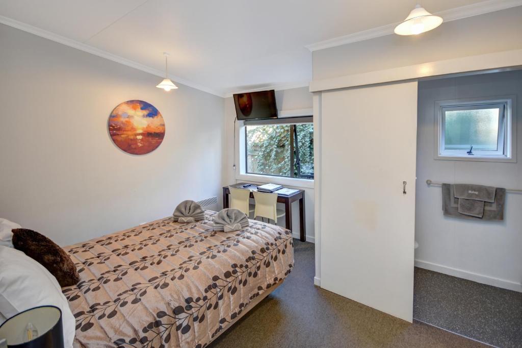 Postel nebo postele na pokoji v ubytování Garden Motel