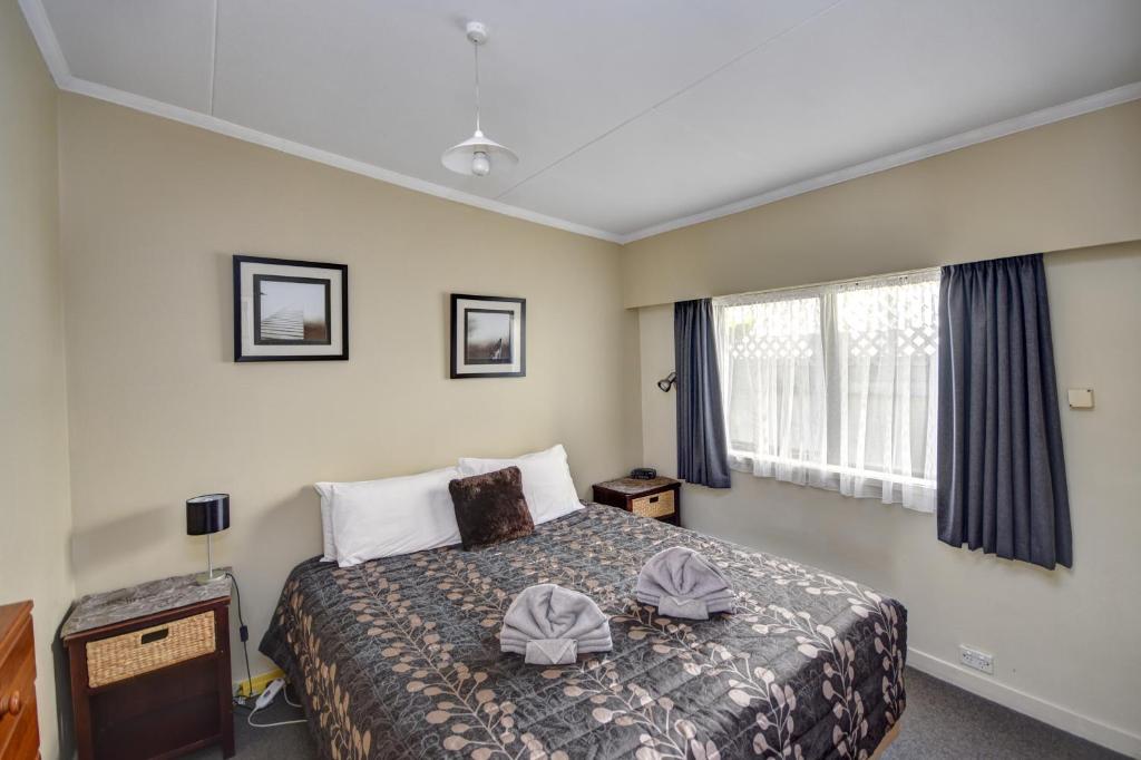 Postel nebo postele na pokoji v ubytování Garden Motel