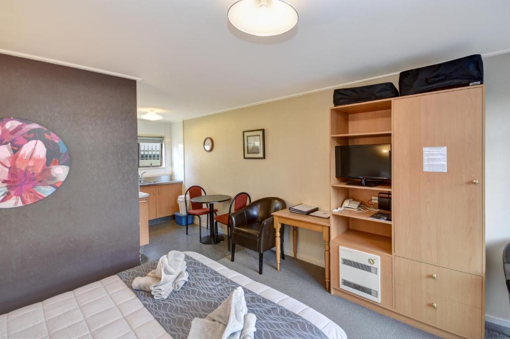 TV a/nebo společenská místnost v ubytování Garden Motel