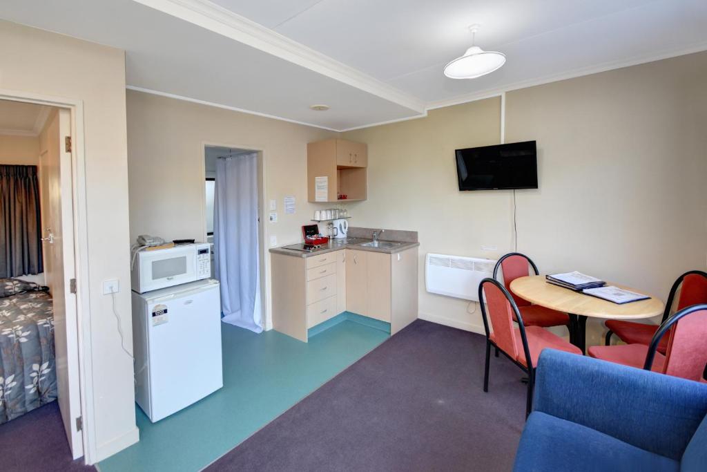 Kuchyň nebo kuchyňský kout v ubytování Garden Motel