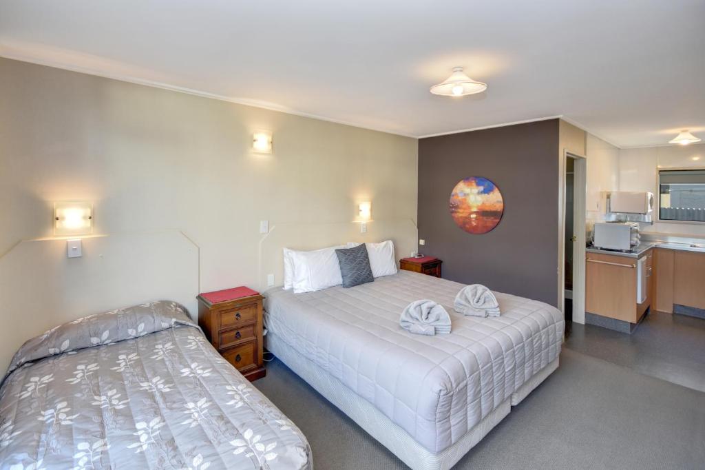 Postel nebo postele na pokoji v ubytování Garden Motel