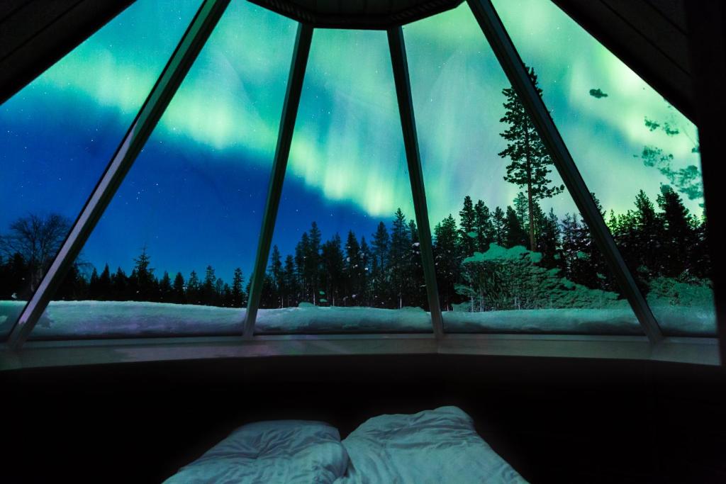 a view of the aurora borealis from a window at Levi Northern Lights Huts in Levi
