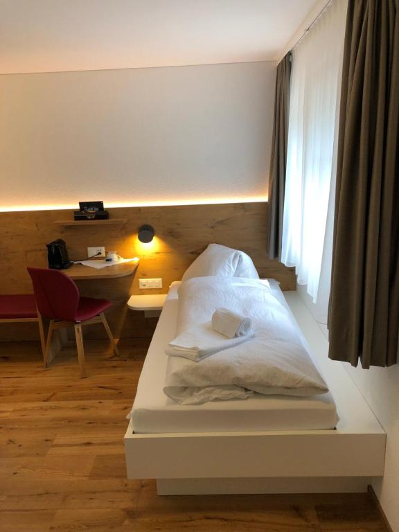 Postel nebo postele na pokoji v ubytování Hotel Walser