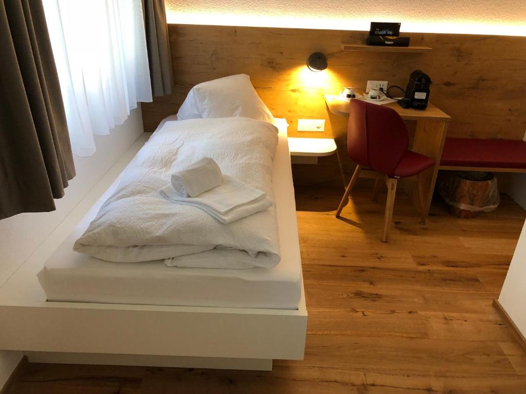 Postel nebo postele na pokoji v ubytování Hotel Walser