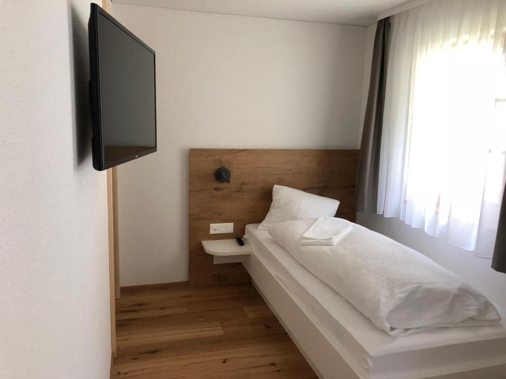 Postel nebo postele na pokoji v ubytování Hotel Walser