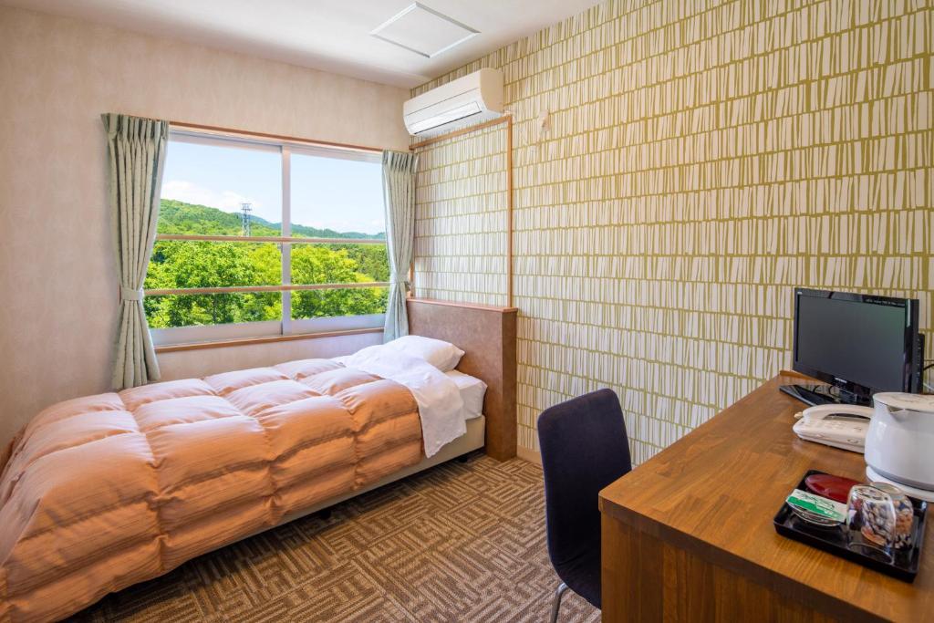 Postel nebo postele na pokoji v ubytování Stay View Ikaho