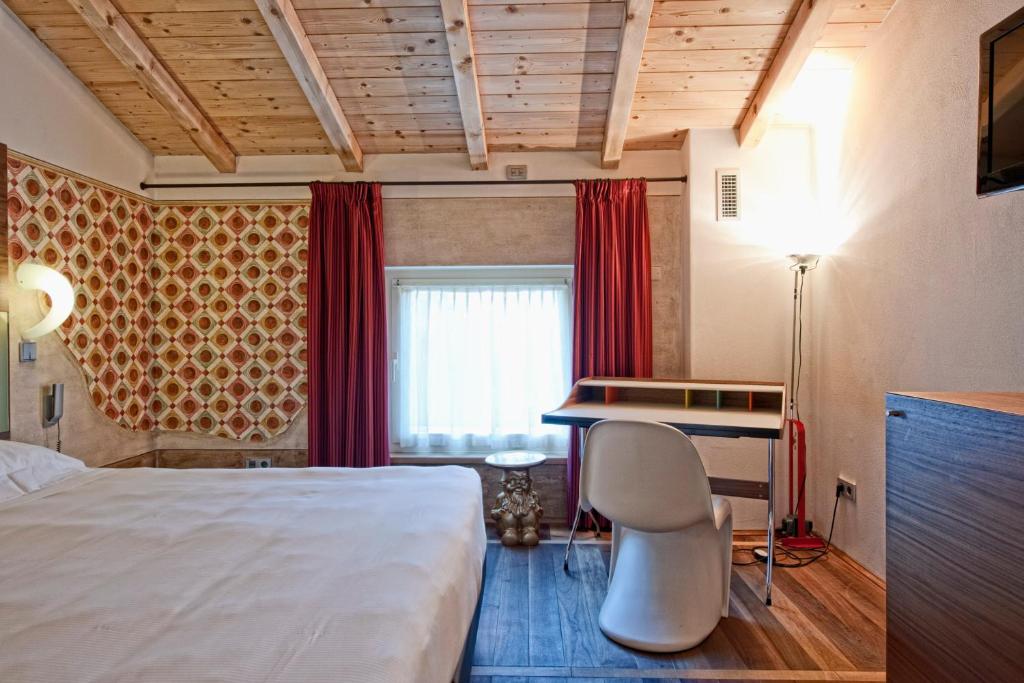 Postel nebo postele na pokoji v ubytování Hotel Veronesi La Torre