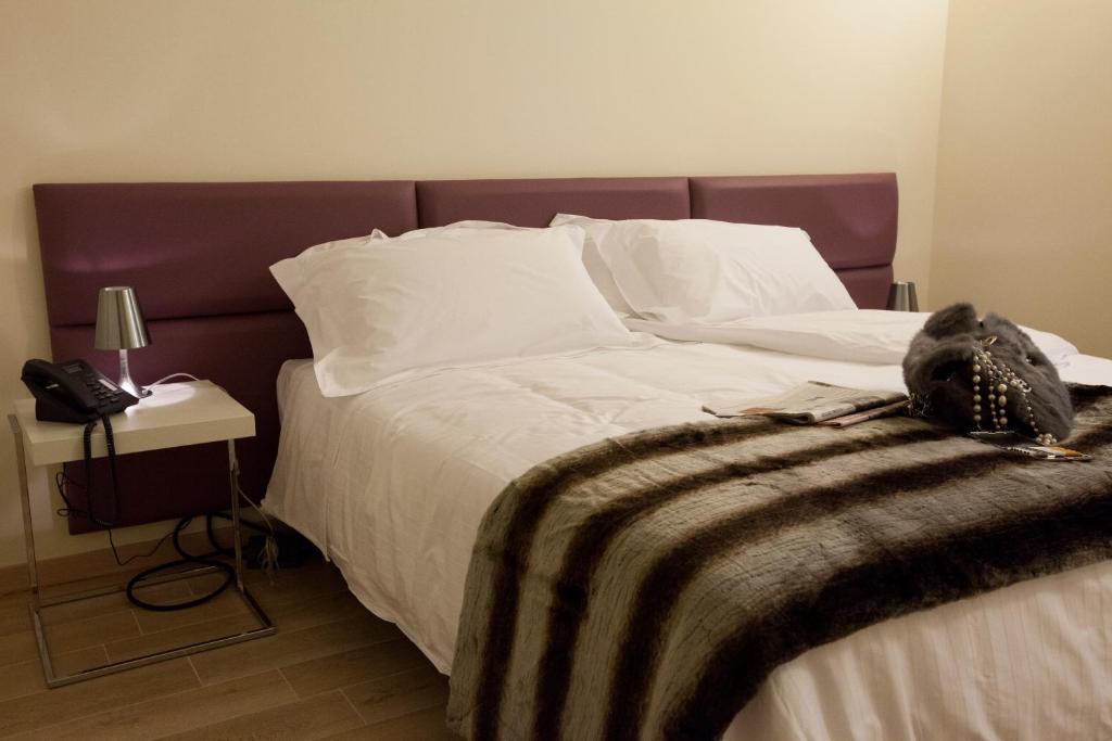 Postel nebo postele na pokoji v ubytování Residenza Agnello D'Oro