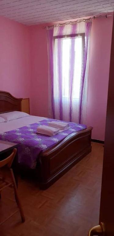 Postel nebo postele na pokoji v ubytování Hotel Giovannina