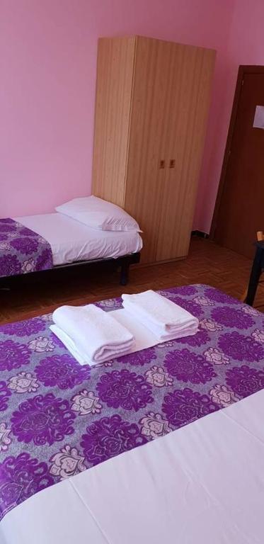 Postel nebo postele na pokoji v ubytování Hotel Giovannina