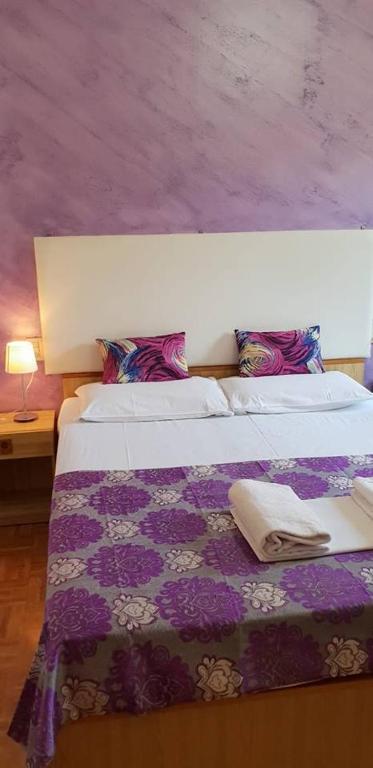 Postel nebo postele na pokoji v ubytování Hotel Giovannina