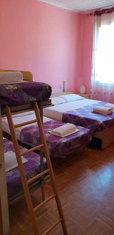 Postel nebo postele na pokoji v ubytování Hotel Giovannina