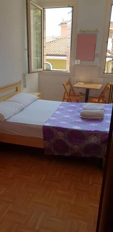 Postel nebo postele na pokoji v ubytování Hotel Giovannina
