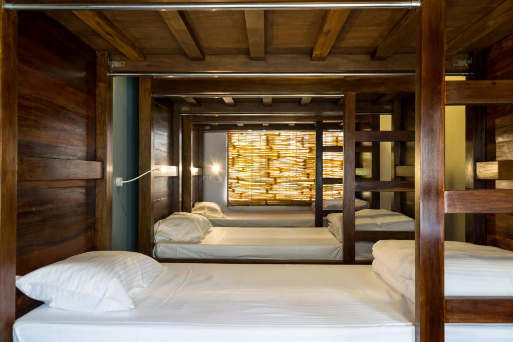 מיטה או מיטות בחדר ב-Micasa Hostels