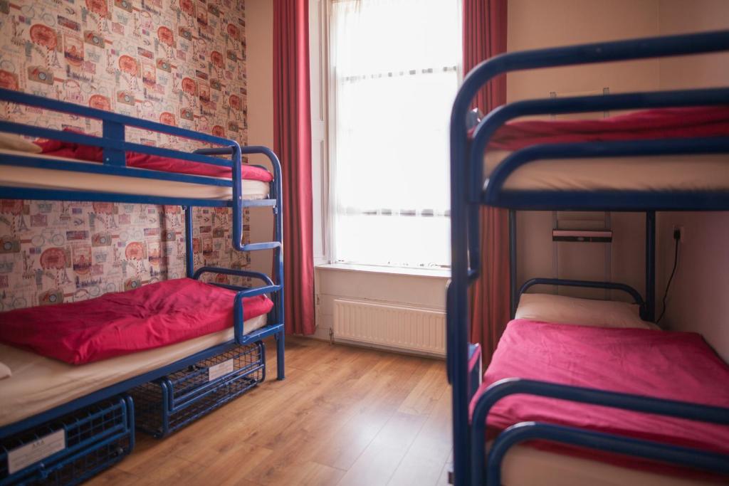 Postel nebo postele na pokoji v ubytování Ashfield Hostel