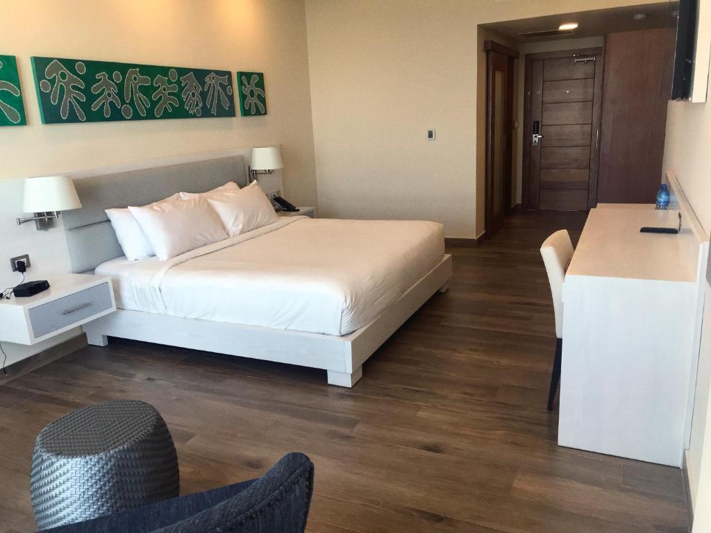 Postel nebo postele na pokoji v ubytování Satama Hotel