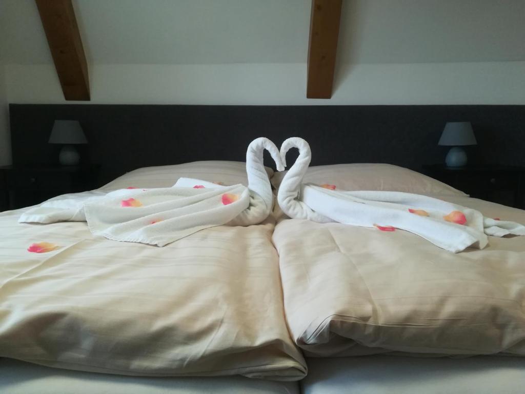 Postel nebo postele na pokoji v ubytování Penzión Chata Valaška