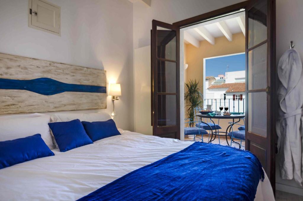 Postel nebo postele na pokoji v ubytování StayCatalina Boutique Hotel-Apartments