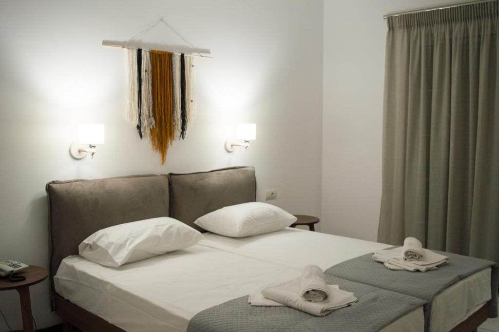 Postel nebo postele na pokoji v ubytování Paradise Beach Hotel