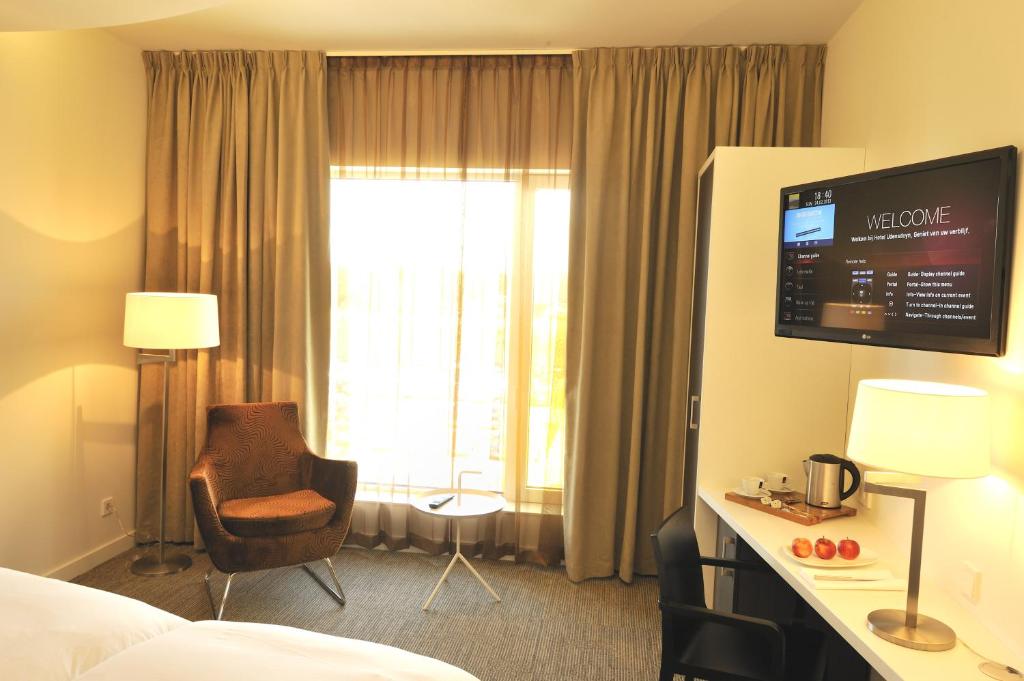 TV a/nebo společenská místnost v ubytování Hotel Udens Duyn