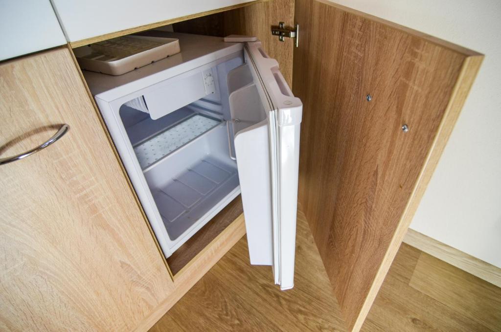 Postel nebo postele na pokoji v ubytování Rodinný wellness hotel U Langrů