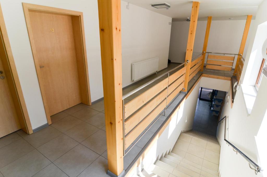 Postel nebo postele na pokoji v ubytování Rodinný wellness hotel U Langrů