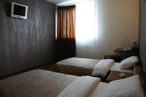 Postel nebo postele na pokoji v ubytování Hotel Esprit