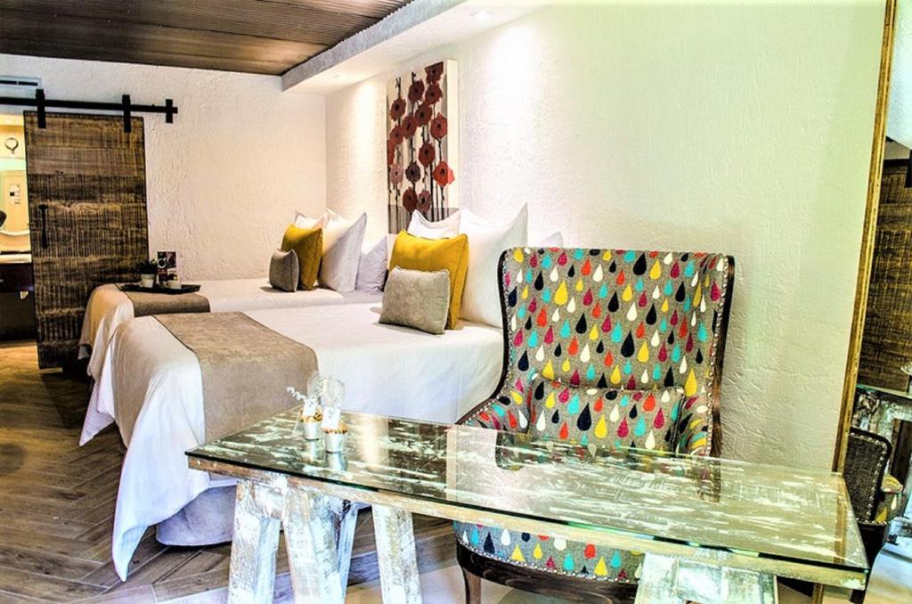 Postel nebo postele na pokoji v ubytování NEhotel Nueva Estancia
