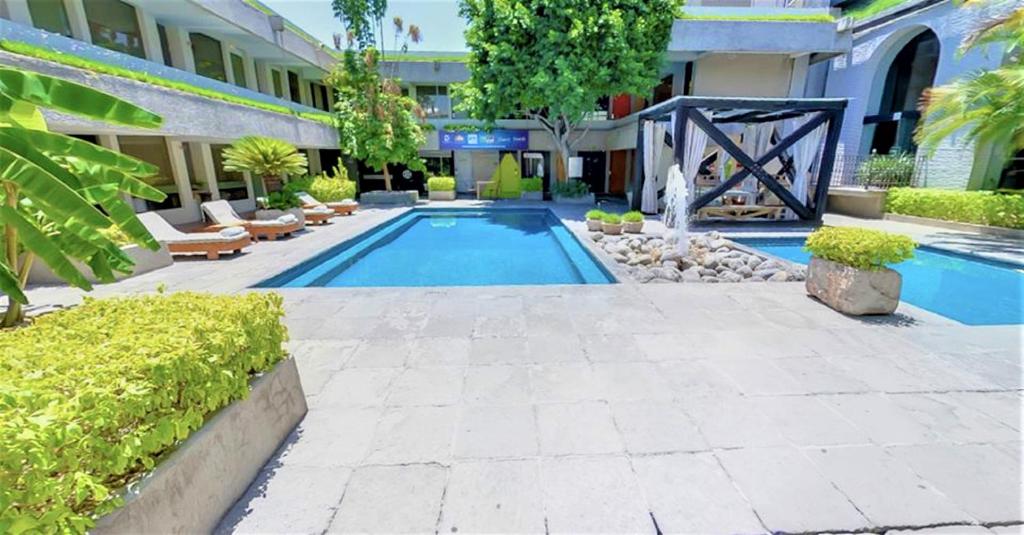 Bazén v ubytování NEhotel Nueva Estancia nebo v jeho okolí