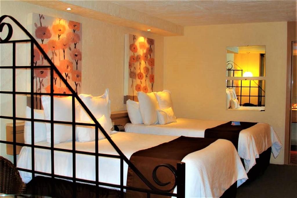 Postel nebo postele na pokoji v ubytování NEhotel Nueva Estancia