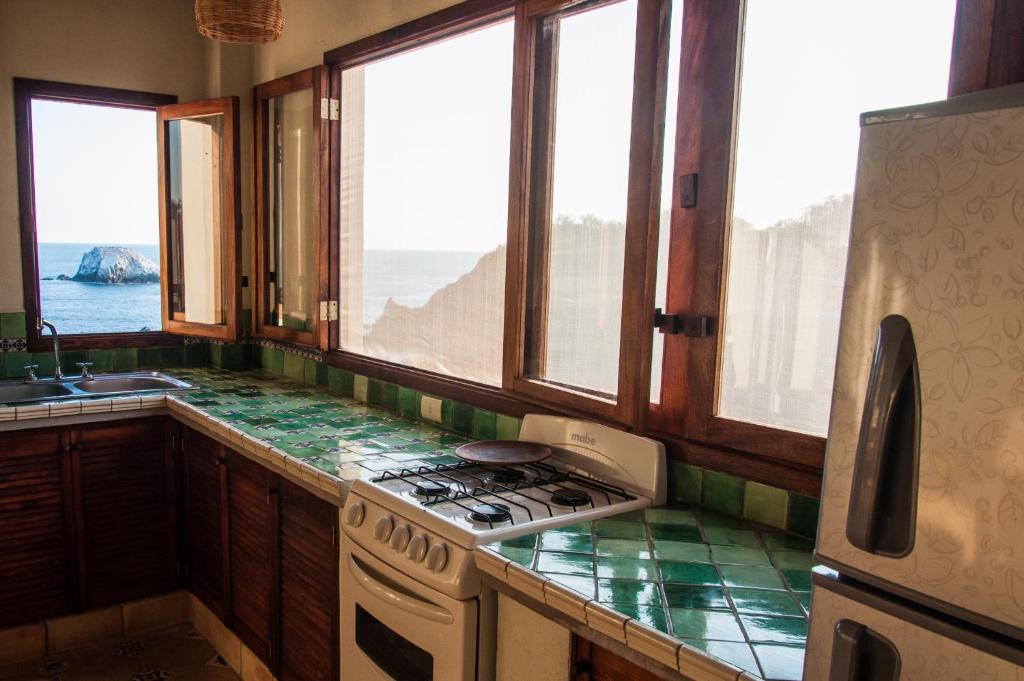 Kuchyň nebo kuchyňský kout v ubytování HEVEN Residence