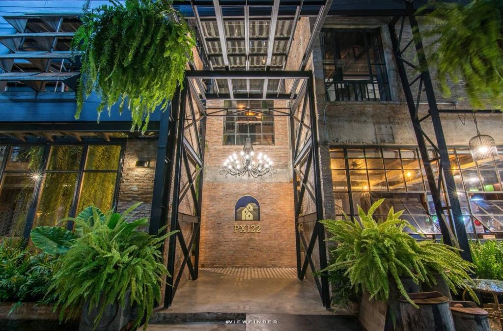 an entrance to a building with plants in front of it at PX122 DBEST HOTEL in Nan