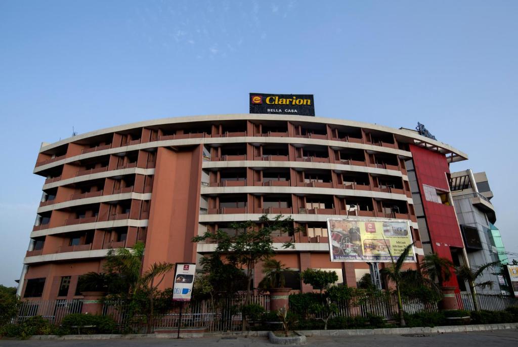 a building with a sign on top of it at Clarion Bella Casa at Airport in Jaipur