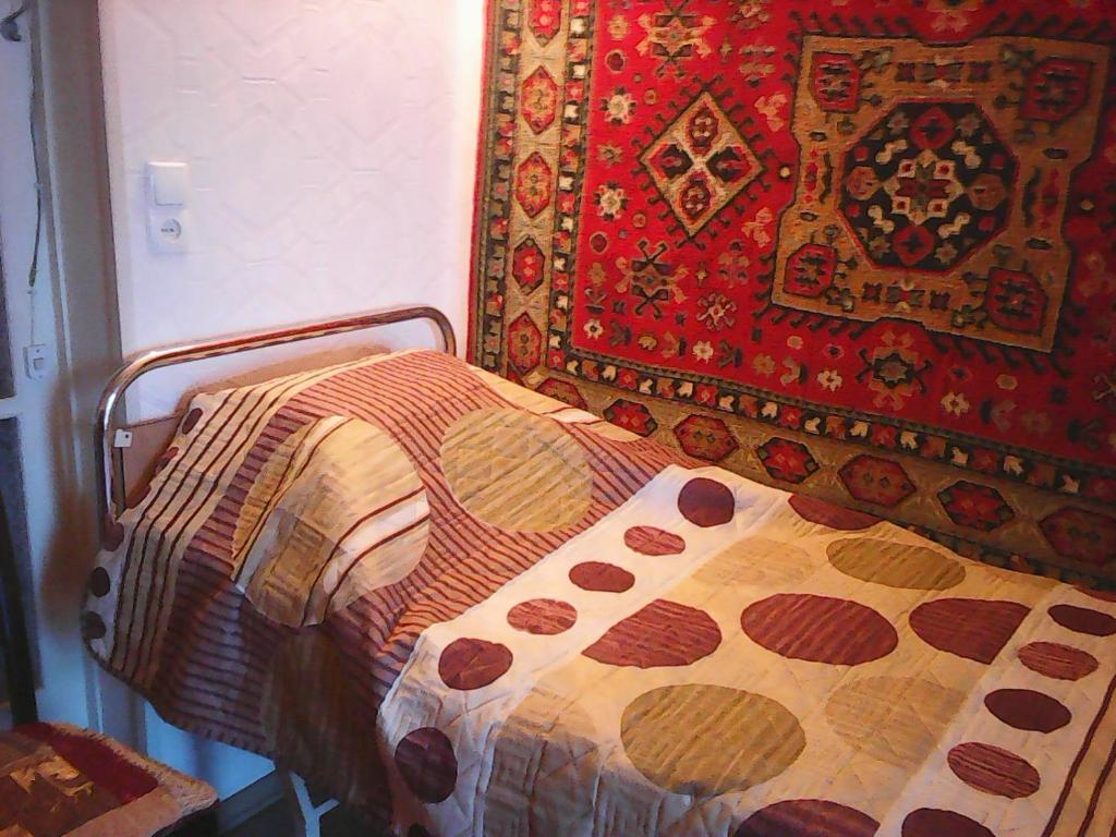 Postel nebo postele na pokoji v ubytování Бабушкин уют в РУСТАВИ