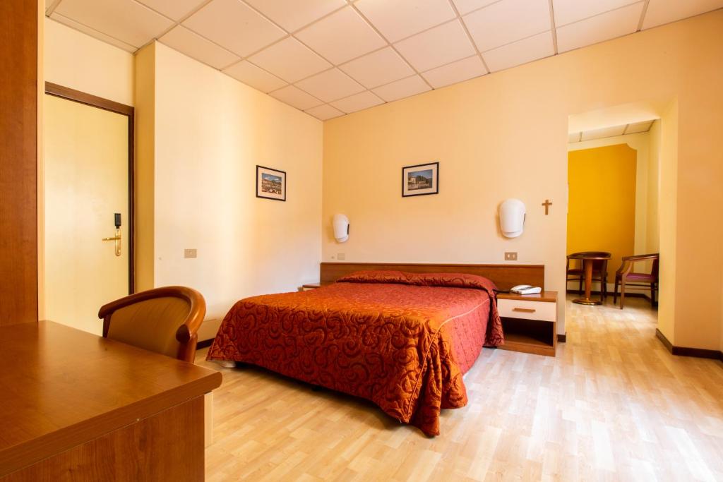 Postel nebo postele na pokoji v ubytování Hotel Il Chiostro by LVG Hotel Collection