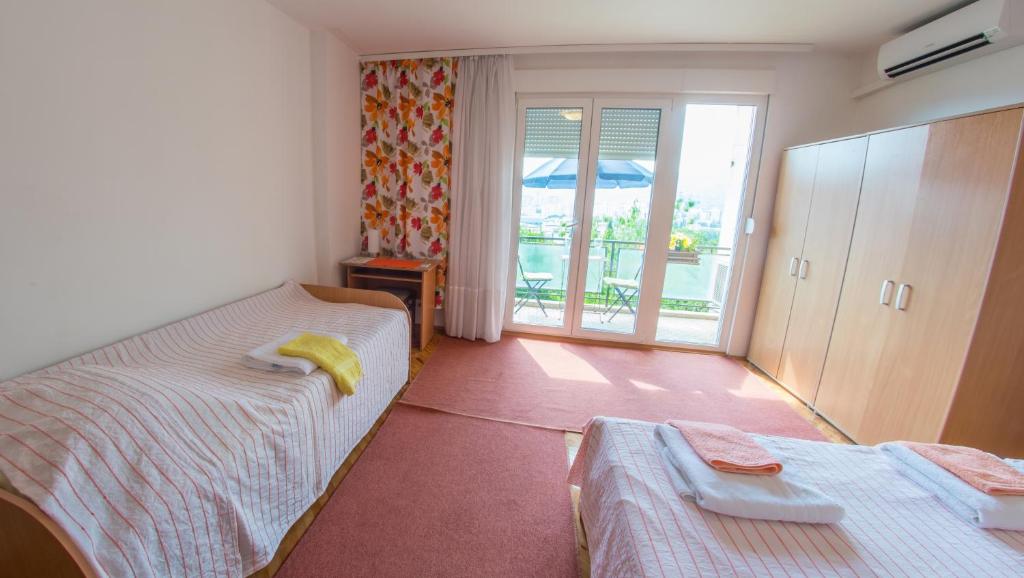 Postel nebo postele na pokoji v ubytování Guest House Agava
