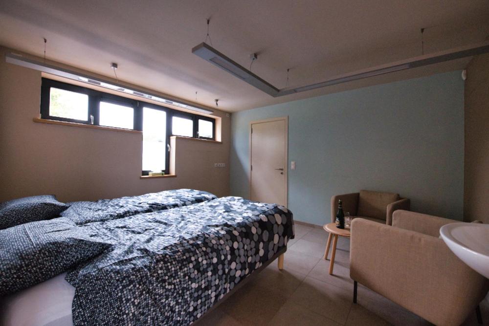 Postel nebo postele na pokoji v ubytování l'Ardenne buissonière