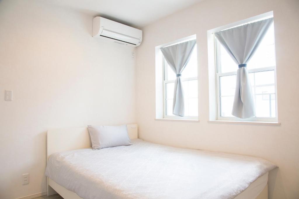 Postel nebo postele na pokoji v ubytování Guest House Diphylleia Grayi