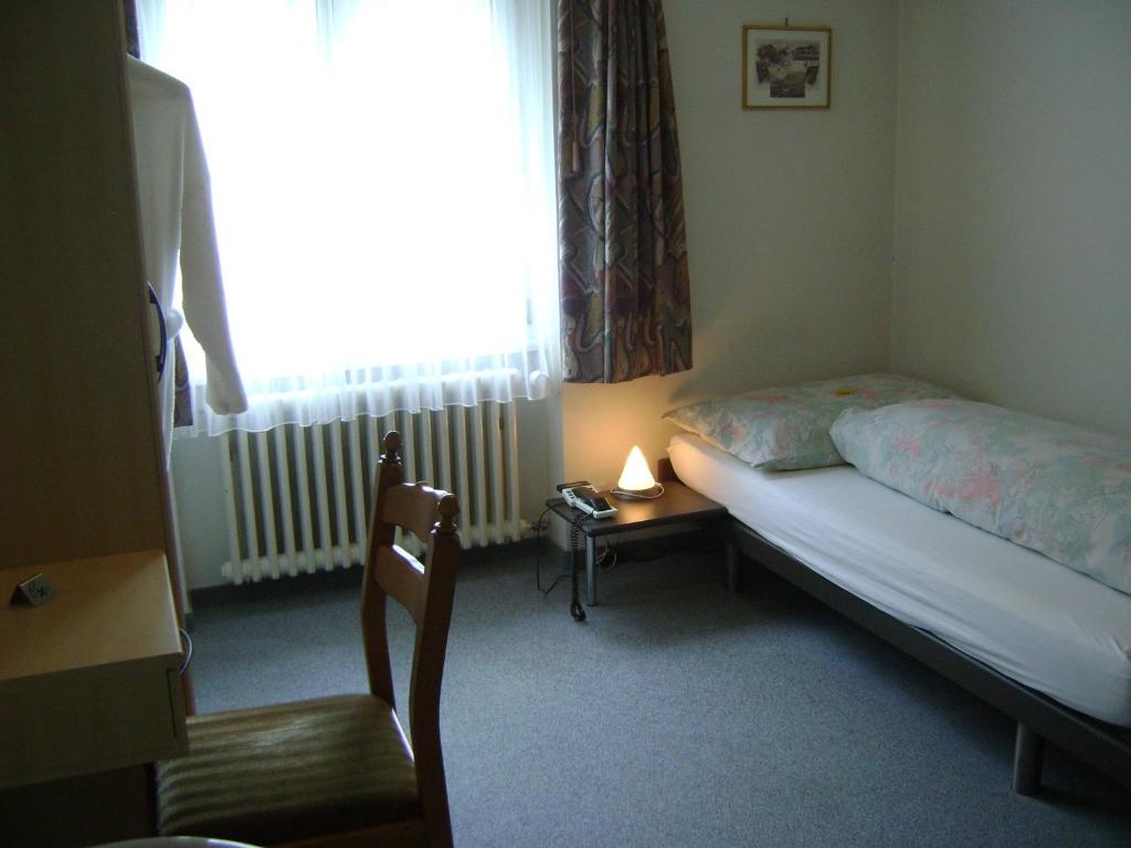Postel nebo postele na pokoji v ubytování Gasthaus Post