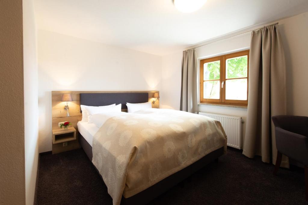 Postel nebo postele na pokoji v ubytování Hotel Haflhof
