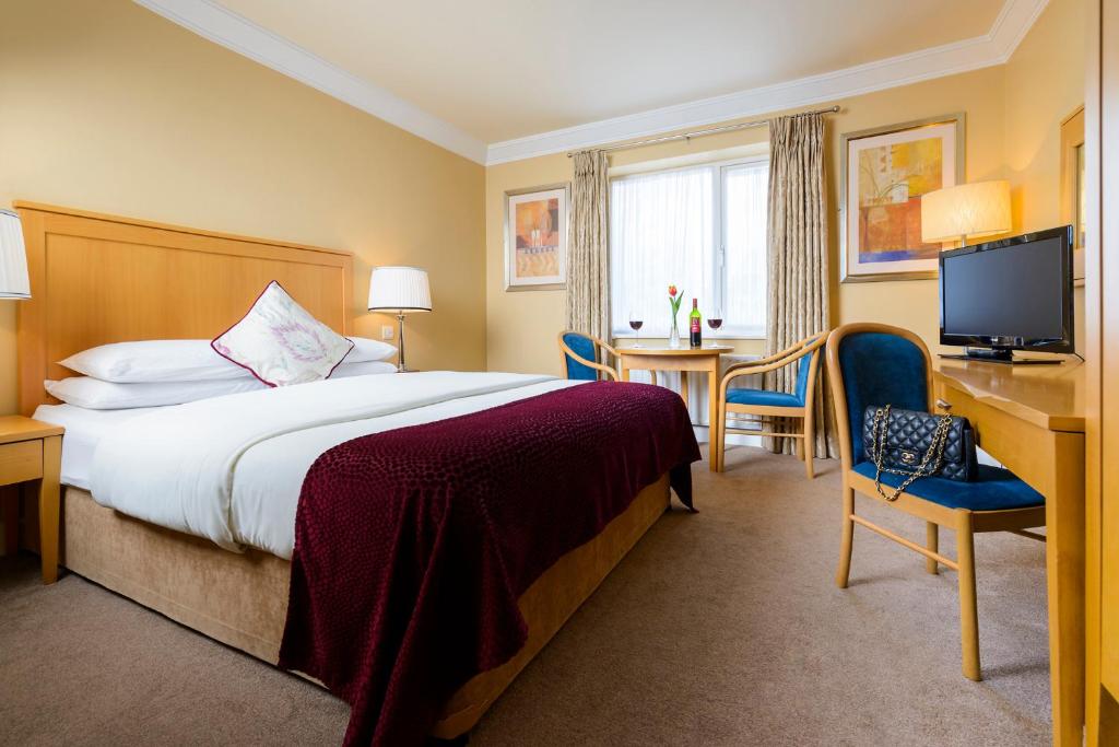 Krevet ili kreveti u jedinici u okviru objekta Dingle Bay Hotel