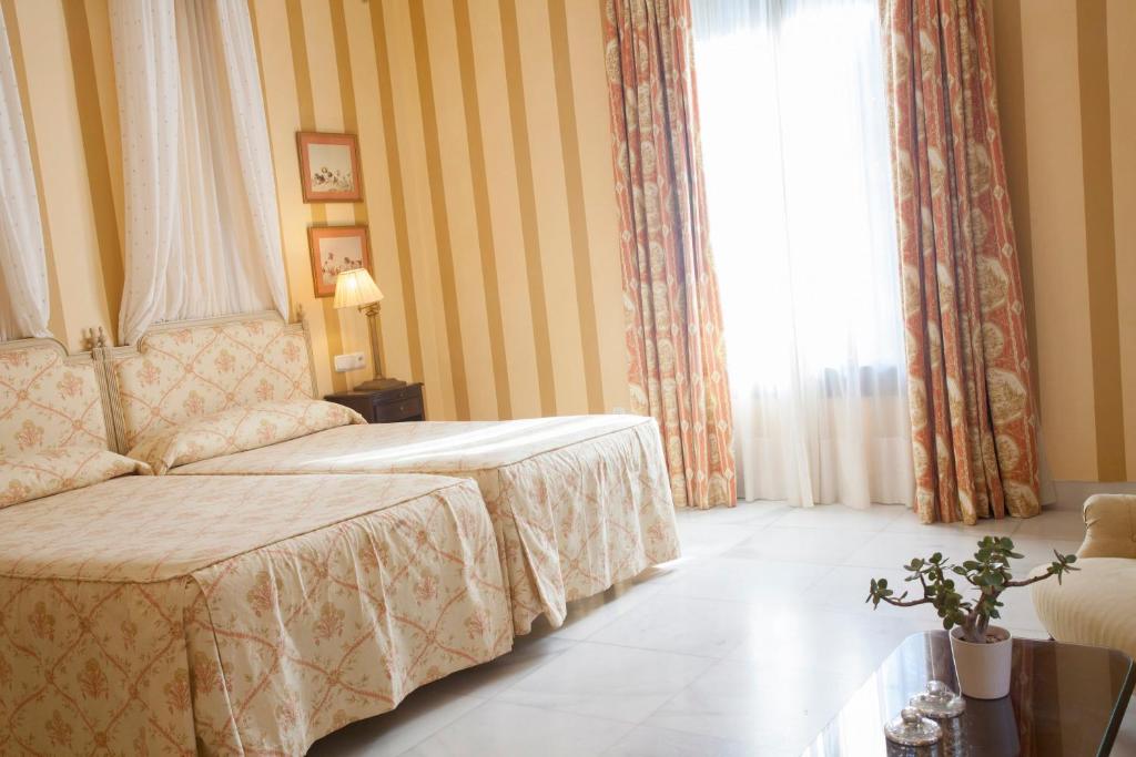 Postel nebo postele na pokoji v ubytování Villa Jerez