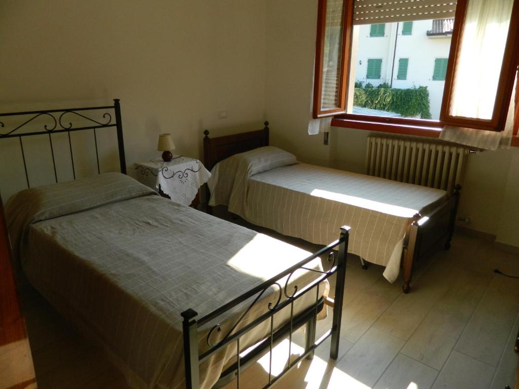 Postel nebo postele na pokoji v ubytování Villa Ester