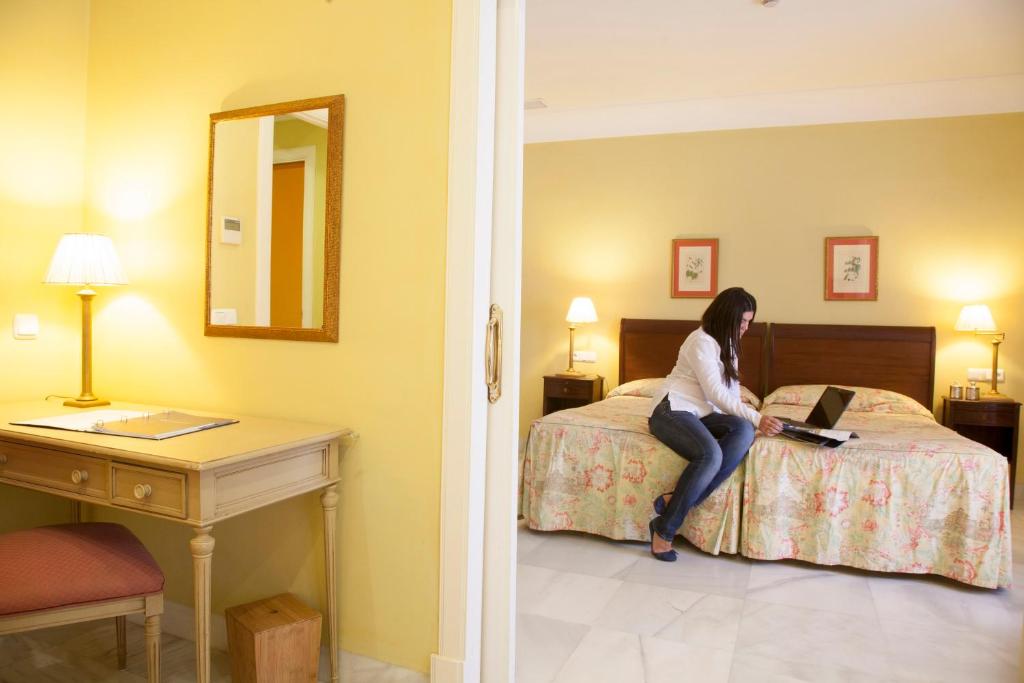 Postel nebo postele na pokoji v ubytování Villa Jerez